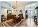 Elegant dining room featuring hardwood floors, chandelier lighting, and easy access to the front entry at 3728 Granada Gorge Ln, North Las Vegas, NV 89084