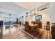 Bright open floor plan showcasing the dining area with hardwood floors and classic furnishings at 3728 Granada Gorge Ln, North Las Vegas, NV 89084