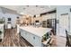 Spacious open kitchen with stainless appliances, large island with seating, and custom cabinets at 3728 Granada Gorge Ln, North Las Vegas, NV 89084