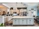 Bright kitchen with large center island, stainless appliances and custom cabinets at 3728 Granada Gorge Ln, North Las Vegas, NV 89084
