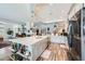 Bright kitchen with a large island and custom cabinets, open to the living area at 3728 Granada Gorge Ln, North Las Vegas, NV 89084
