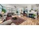 Bright living room with open floor plan with ceiling fan, a fireplace and lots of light at 3728 Granada Gorge Ln, North Las Vegas, NV 89084