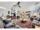 Open concept living room with large couch, fireplace, and direct access to the kitchen at 3728 Granada Gorge Ln, North Las Vegas, NV 89084