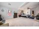 This is a spacious primary bedroom that features a ceiling fan, two windows, and is carpeted at 3728 Granada Gorge Ln, North Las Vegas, NV 89084