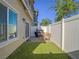 Small backyard features turf and a patio with barbecue at 3783 Canis Minor Ln # 6104, Henderson, NV 89052