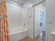Bright bathroom featuring a tiled shower-tub combination with decorative shower curtain at 3783 Canis Minor Ln # 6104, Henderson, NV 89052