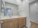 Bathroom features a double sink vanity with a large mirror and tile flooring at 3783 Canis Minor Ln # 6104, Henderson, NV 89052