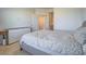Bedroom with neutral walls, comfortable bed, dresser, and a view to the bathroom at 3783 Canis Minor Ln # 6104, Henderson, NV 89052