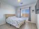Bright bedroom with hardwood floors, a large window, and neutral decor at 3783 Canis Minor Ln # 6104, Henderson, NV 89052