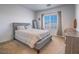Bright bedroom featuring a cozy bed, a window with blinds, and stylish furnishings at 3783 Canis Minor Ln # 6104, Henderson, NV 89052