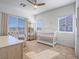 Bright Bedroom with a crib, chair, and multiple windows for natural light at 3783 Canis Minor Ln # 6104, Henderson, NV 89052