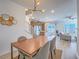 Open dining area connected to living room featuring contemporary light fixture and modern decor at 3783 Canis Minor Ln # 6104, Henderson, NV 89052