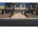 Charming townhome featuring a private garage and well-maintained landscaping at 3783 Canis Minor Ln # 6104, Henderson, NV 89052