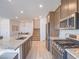 Open concept kitchen with stainless steel appliances, staircase and view of dining area at 3783 Canis Minor Ln # 6104, Henderson, NV 89052