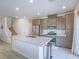 Kitchen view with modern appliances, light gray cabinets and granite countertops at 3783 Canis Minor Ln # 6104, Henderson, NV 89052