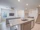 Open concept floor plan featuring a kitchen island with a sink and light gray cabinets at 3783 Canis Minor Ln # 6104, Henderson, NV 89052