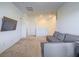 Cozy living room boasts neutral walls, plush carpeting, and a comfortable gray sectional sofa at 3783 Canis Minor Ln # 6104, Henderson, NV 89052