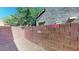Cozy and private backyard space enclosed by a sturdy brick wall at 3820 Ice Storm Ct, Las Vegas, NV 89129