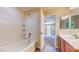 Bathroom with tile, shower, and view into the bedroom at 3820 Ice Storm Ct, Las Vegas, NV 89129