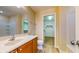 Bathroom vanity with sink and a view of a walk-in closet at 3820 Ice Storm Ct, Las Vegas, NV 89129