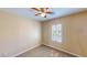 Bedroom with a ceiling fan and plantation shutters at 3820 Ice Storm Ct, Las Vegas, NV 89129