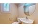 A clean and well-maintained half bathroom with a pedestal sink and modern fixtures at 3820 Ice Storm Ct, Las Vegas, NV 89129