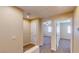 An open hallway with neutral walls leads to various rooms, showcasing the home's layout and design at 3820 Ice Storm Ct, Las Vegas, NV 89129