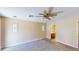 Spacious carpeted main bedroom featuring natural light, ceiling fan, and ensuite bath at 3820 Ice Storm Ct, Las Vegas, NV 89129