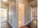 Hallway with hardwood floors, showcasing access to a bathroom and other living spaces at 4000 Twain Ave, Las Vegas, NV 89121