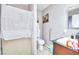 This bathroom offers a shower and sink with neutral colored walls and tile floors at 4145 Plumtree St, Las Vegas, NV 89115