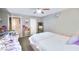 The bedroom features neutral paint, an accent mirror, and an upholstered bed at 4145 Plumtree St, Las Vegas, NV 89115