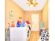 The laundry room includes a washer, dryer, and neutral colored walls and tile floor at 4145 Plumtree St, Las Vegas, NV 89115