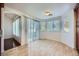 Bright breakfast nook features tile flooring, large sliding door, and large windows at 4620 Standing Bluff Way, Las Vegas, NV 89130