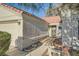 Home featuring a well-maintained yard and a secure front door at 4620 Standing Bluff Way, Las Vegas, NV 89130