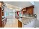 Spacious kitchen features granite counters, stainless steel appliances, wood cabinets, and breakfast nook at 4620 Standing Bluff Way, Las Vegas, NV 89130