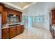 Well-lit kitchen features granite counters, stainless steel appliances, and breakfast nook with many windows at 4620 Standing Bluff Way, Las Vegas, NV 89130