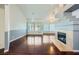Spacious living room featuring beautiful wood floors and a modern fireplace at 4620 Standing Bluff Way, Las Vegas, NV 89130