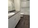 Bathroom featuring a granite vanity, modern fixtures, and a glass-enclosed shower at 532 Clearsable Ave, Henderson, NV 89044
