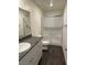 Bathroom featuring a granite vanity, modern fixtures, and a glass-enclosed shower at 532 Clearsable Ave, Henderson, NV 89044