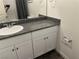 Well-lit bathroom features granite countertop, white cabinetry and contemporary fixtures at 532 Clearsable Ave, Henderson, NV 89044