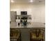 Well-equipped kitchen features stainless steel appliances, granite countertops, and eat-in breakfast bar at 532 Clearsable Ave, Henderson, NV 89044