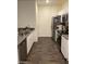 Well-equipped kitchen features stainless steel appliances, granite countertops, and white cabinets at 532 Clearsable Ave, Henderson, NV 89044
