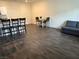 Open-concept living room with dining area and modern dark wood-look flooring at 532 Clearsable Ave, Henderson, NV 89044