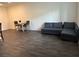 Spacious living room with hardwood floors, dining table and comfortable seating area at 532 Clearsable Ave, Henderson, NV 89044