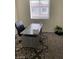 Bright office space with large desk, plush chair, modern rug and natural light at 532 Clearsable Ave, Henderson, NV 89044