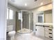 Bathroom with stand up glass door shower, toilet, and white vanity at 5359 Harvest Breeze Rd, Las Vegas, NV 89118