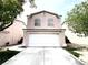 Charming two-story home with a two-car garage and well-maintained front yard at 5359 Harvest Breeze Rd, Las Vegas, NV 89118