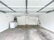 Spacious garage with cement floor, washer, dryer, water heater and white cabinets at 5359 Harvest Breeze Rd, Las Vegas, NV 89118