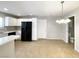 Bright eat-in kitchen with white cabinets and black appliances at 5359 Harvest Breeze Rd, Las Vegas, NV 89118