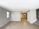 Open-concept living room with tile floors and staircase at 5359 Harvest Breeze Rd, Las Vegas, NV 89118